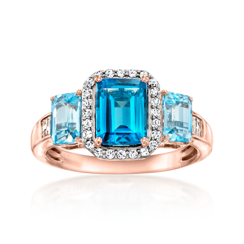 18kt rose gold over sterling ring with rectangular blue topaz center and diamond halo