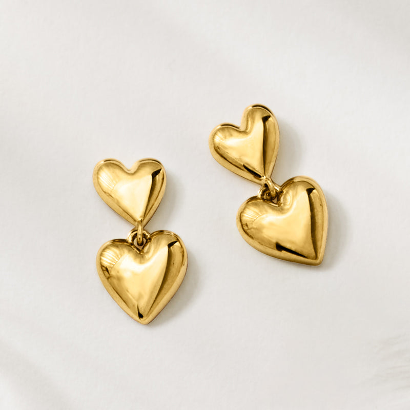 Yellow gold double-heart drop earrings with stacked heart charms and hook