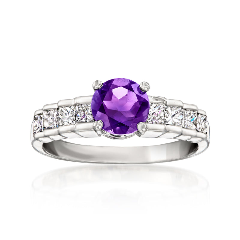Platinum ring with oval amethyst center and prong-set diamond side stones