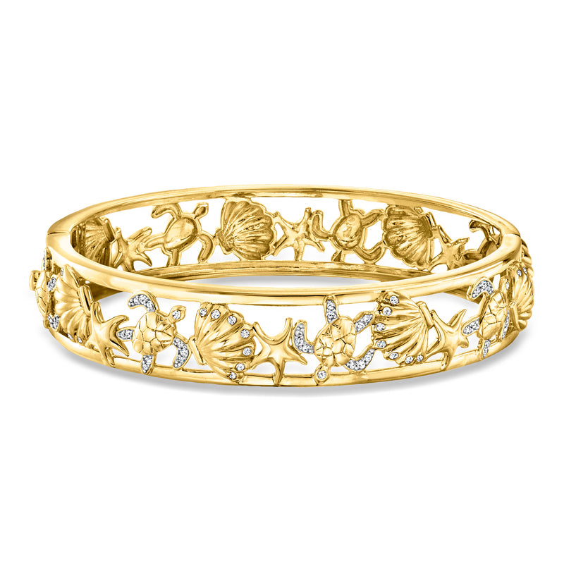 Gold over sterling sea-life bangle with diamond accents; shell and fish openwork