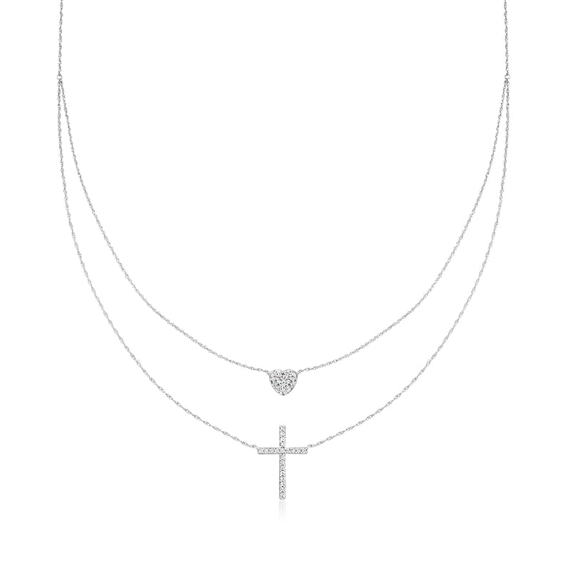Layered sterling silver necklace with heart and cross diamond charms