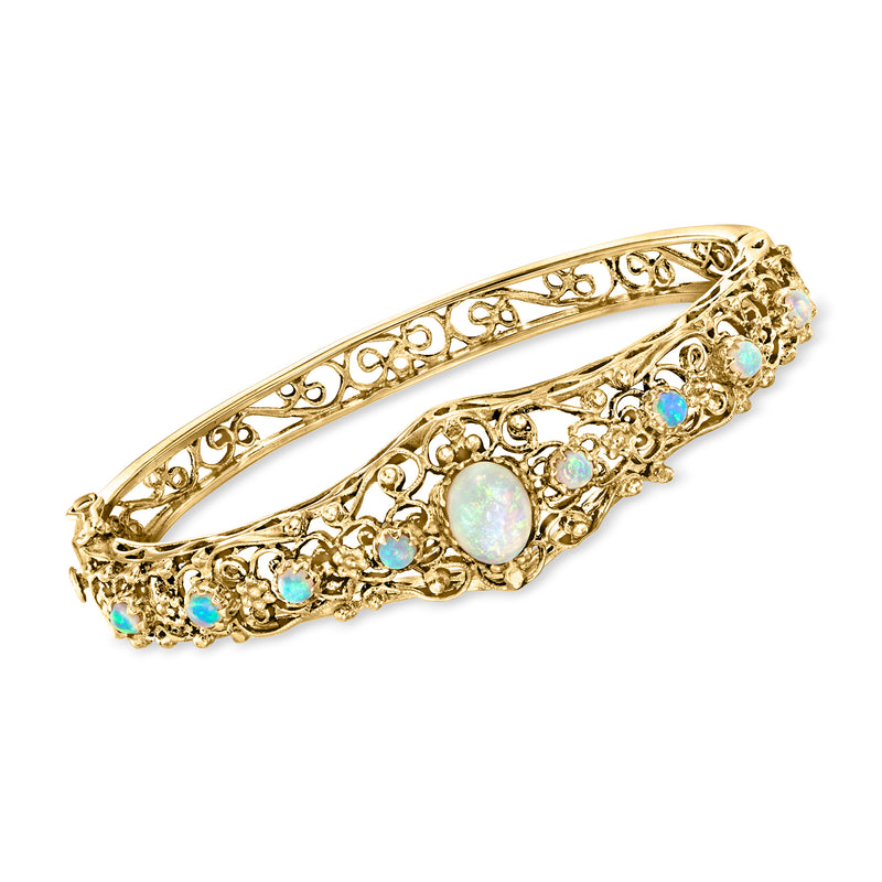 14kt yellow gold filigree bangle with opal cabochon and blue-green stone accents