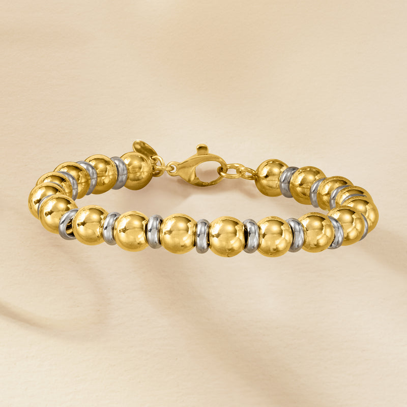 Two-tone round bead bracelet with gold finish, silver accents, and toggle clasp