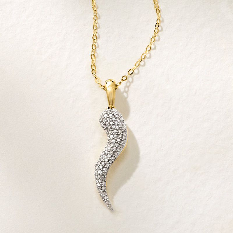 10kt yellow gold horn pendant with pave diamond curved shape and bail.