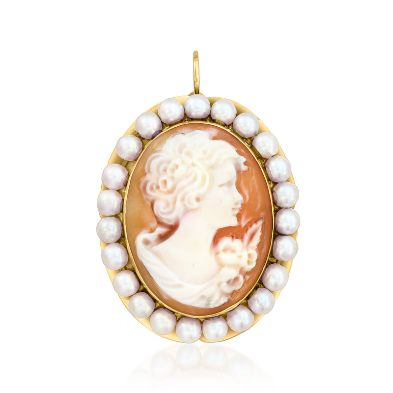 Gold cameo pendant with orange shell face, framed by round white cultured pearls