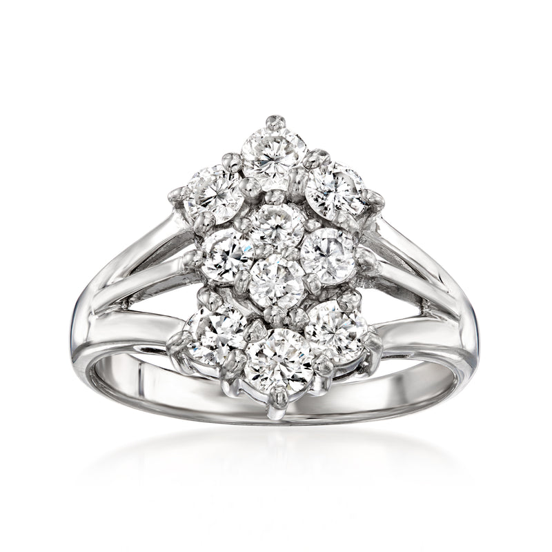 Platinum diamond cluster ring with round stones and oval center