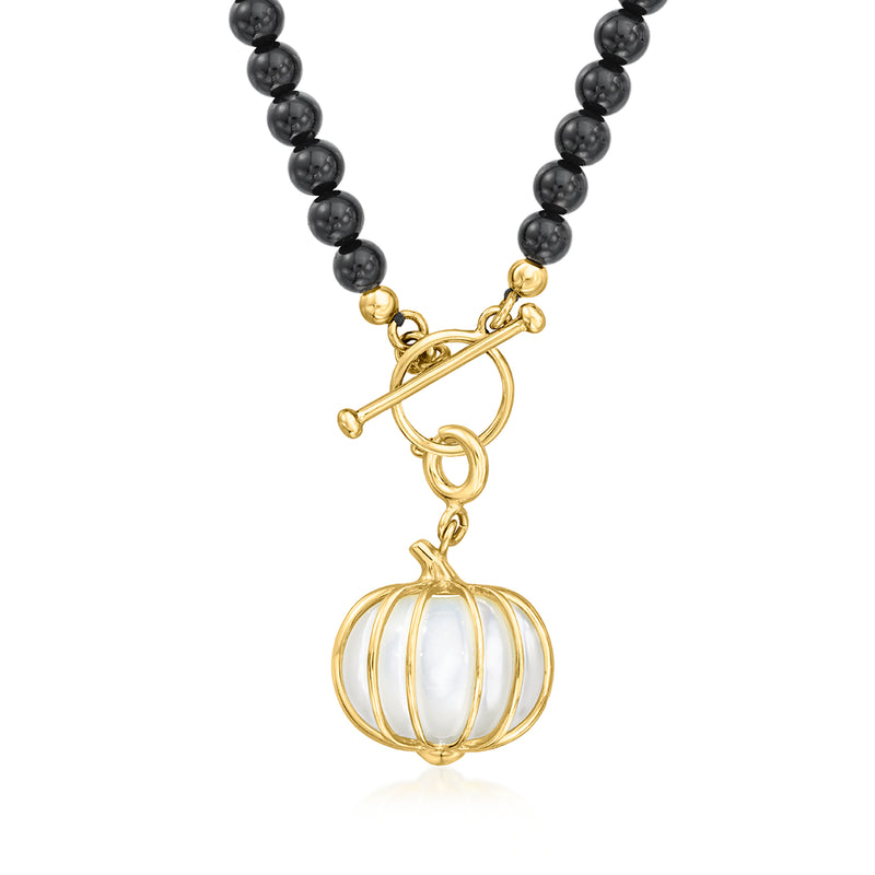 Gold pumpkin charm pendant with white iridescent center on black bead chain