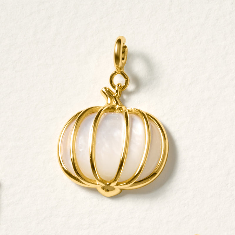 Gold pumpkin charm with white iridescent ribbed body and hanging bail
