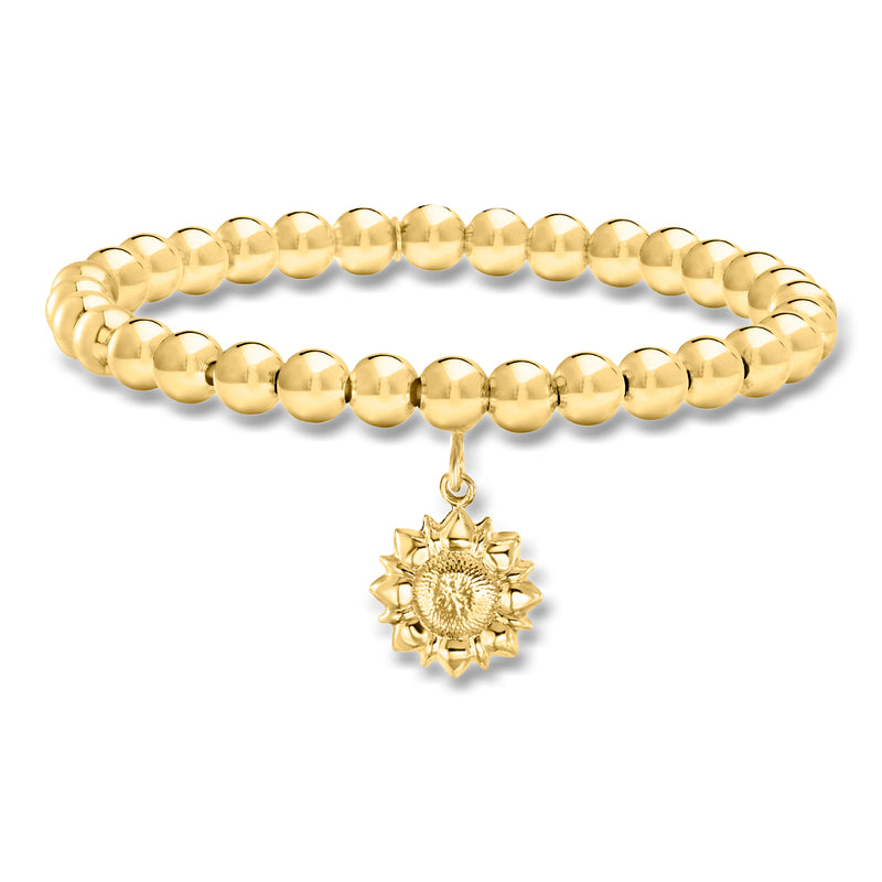Gold beaded stretch bracelet with dangling sunflower charm