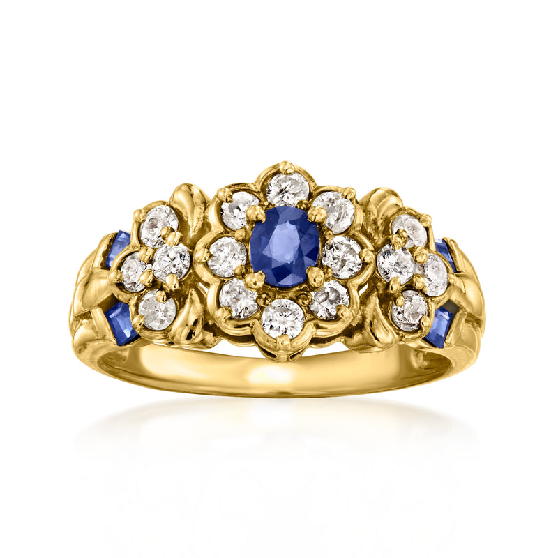 Vintage flower ring in 18k yellow gold with blue sapphire center and white diamonds