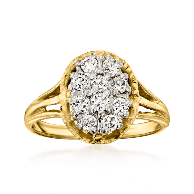 Vintage oval diamond cluster ring in 14kt yellow gold with round-cut diamonds