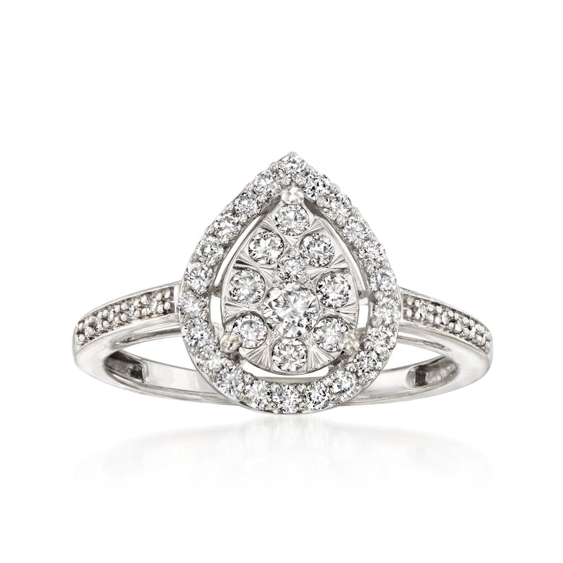 Vintage diamond cluster ring in 14kt white gold, halo of round stones