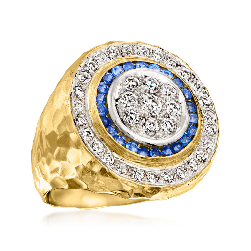 Vintage ring angled view: gold and platinum, diamond center with blue sapphire halo