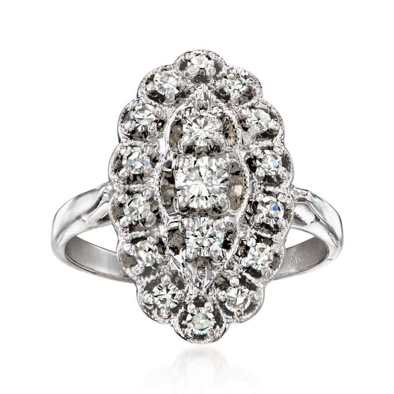 Vintage diamond cluster ring in 14kt white gold with oval and round stones