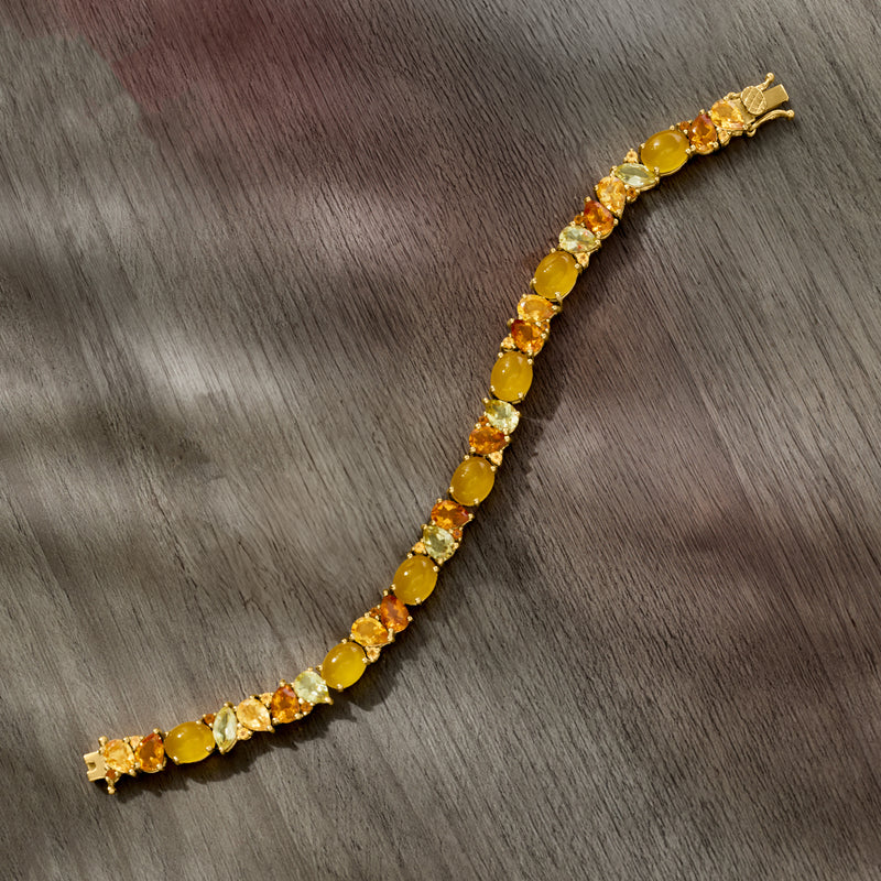 Yellow gemstone tennis bracelet in gold-tone setting with oval and round cut stones