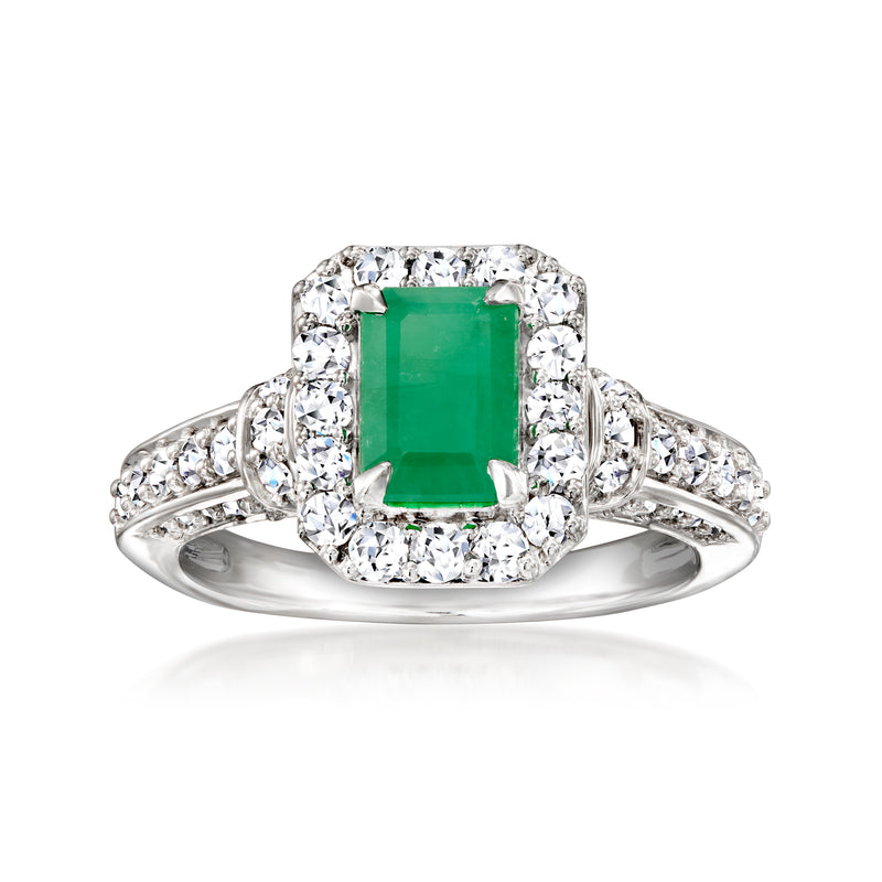 Sterling silver emerald-cut green gemstone ring with diamond halo and band.