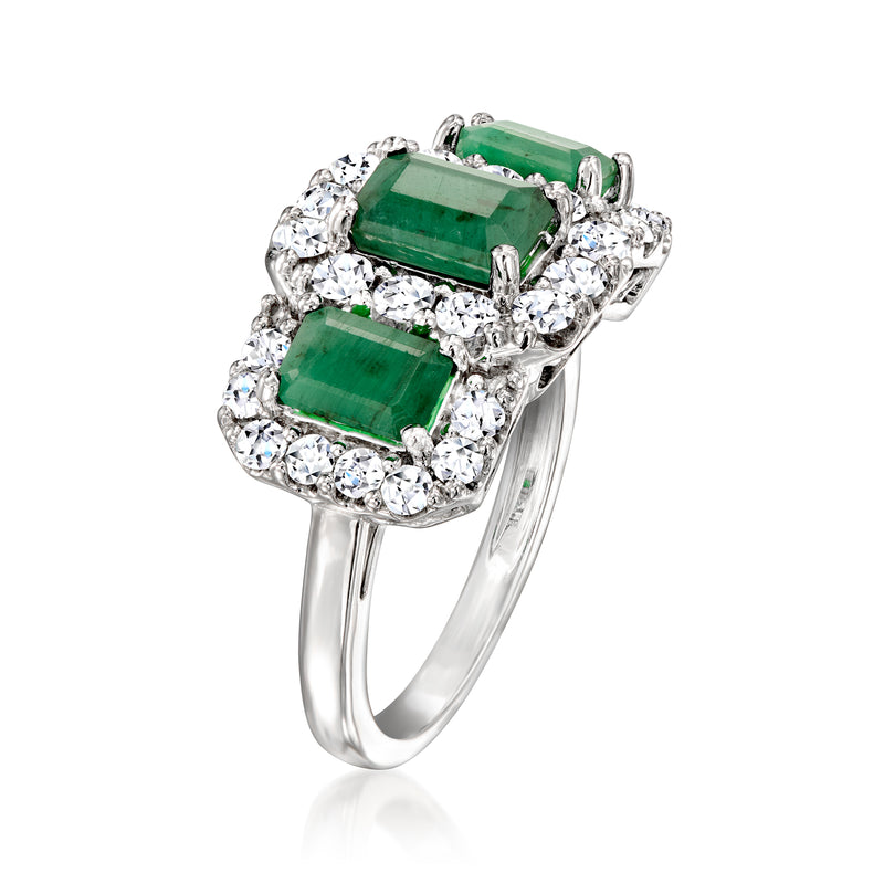Sterling silver ring with an emerald-cut green center stone and clear stone halo