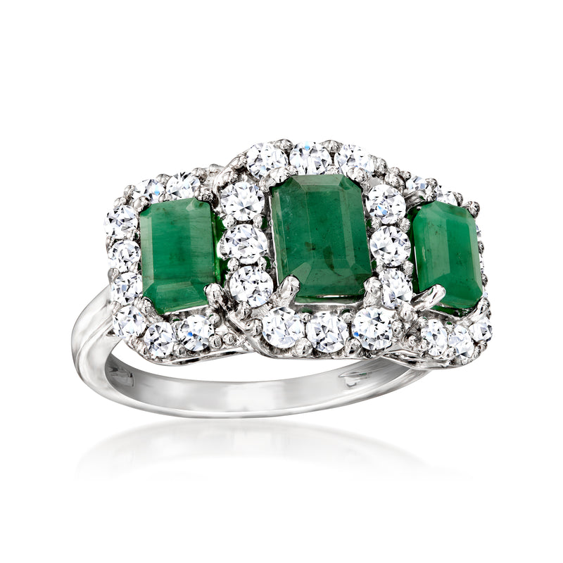 Sterling silver ring with three emerald-cut green stones surrounded by clear diamonds