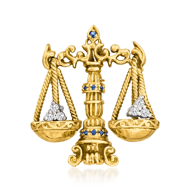 Vintage 18k gold balance scales pin with diamond accents and blue sapphire details