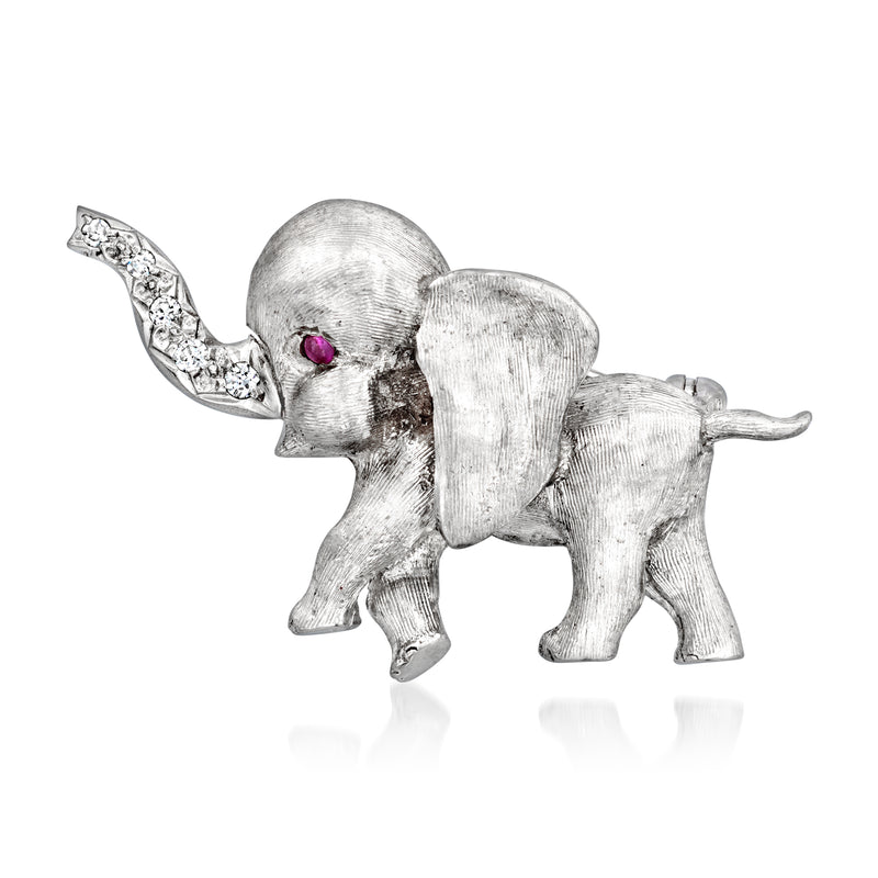 White gold elephant lapel pin with diamond accents and single ruby eye