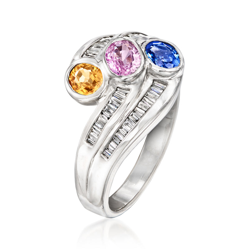 White gold ring with oval blue and pink sapphires, orange oval, diamond baguette band