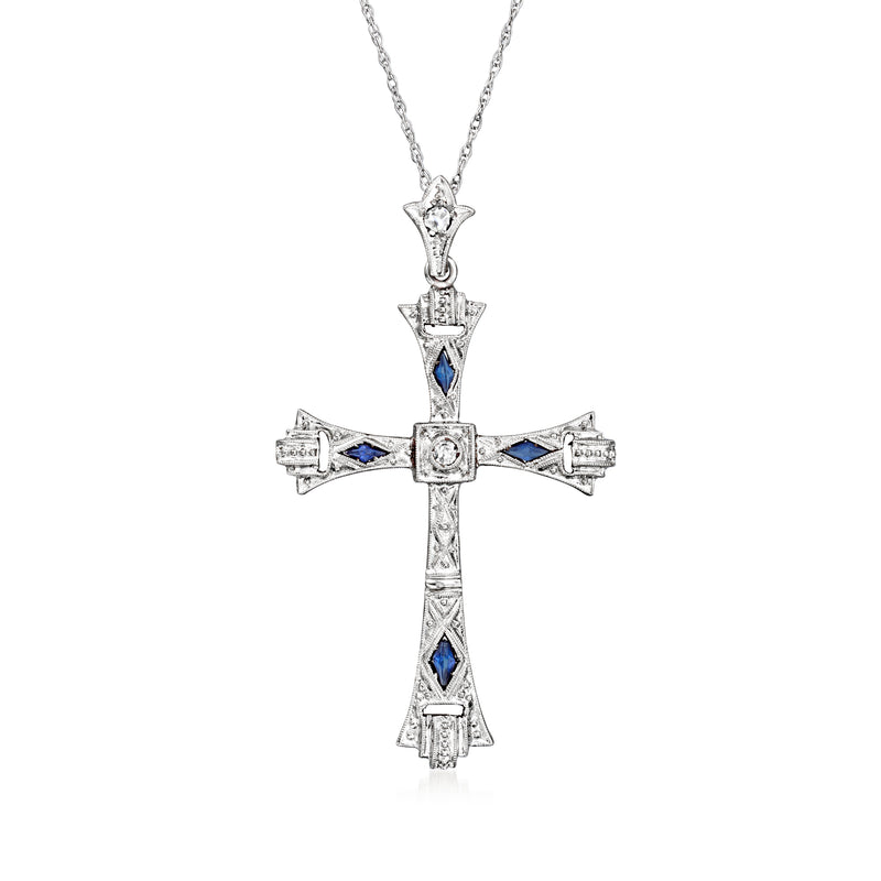 Vintage cross pendant necklace with blue sapphire insets and diamond accents, silver-toned chain
