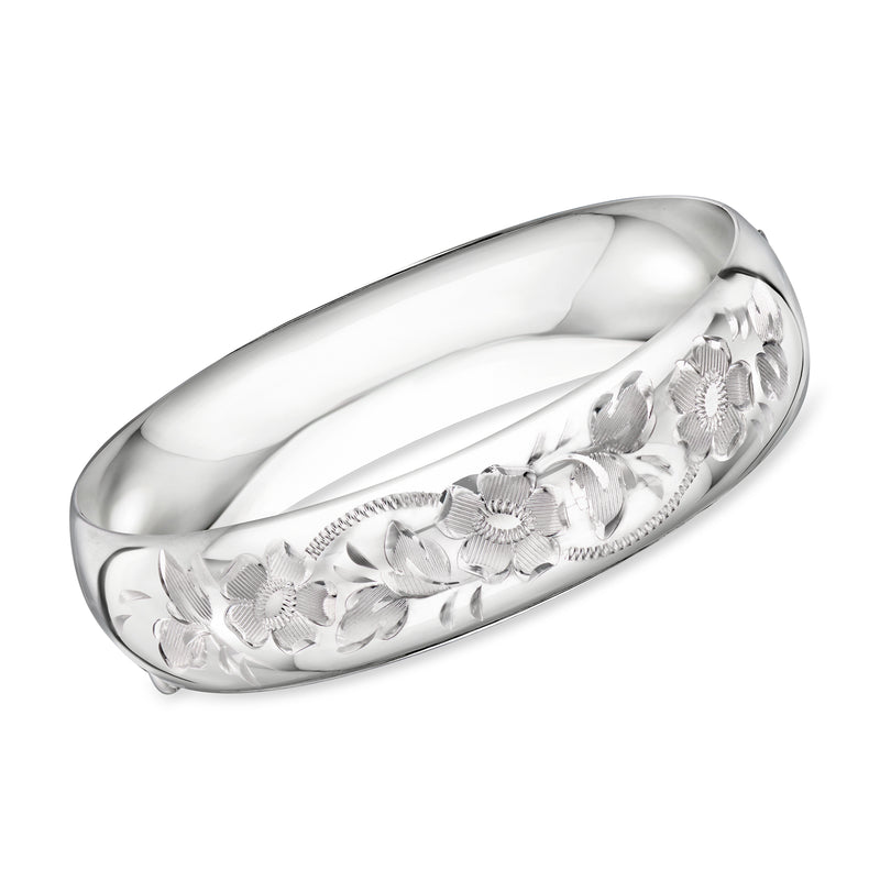 Sterling silver floral bangle bracelet with raised flower detailing along the band