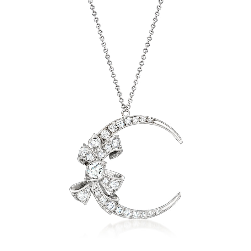 Diamond crescent moon necklace with bow accents, platinum and white gold