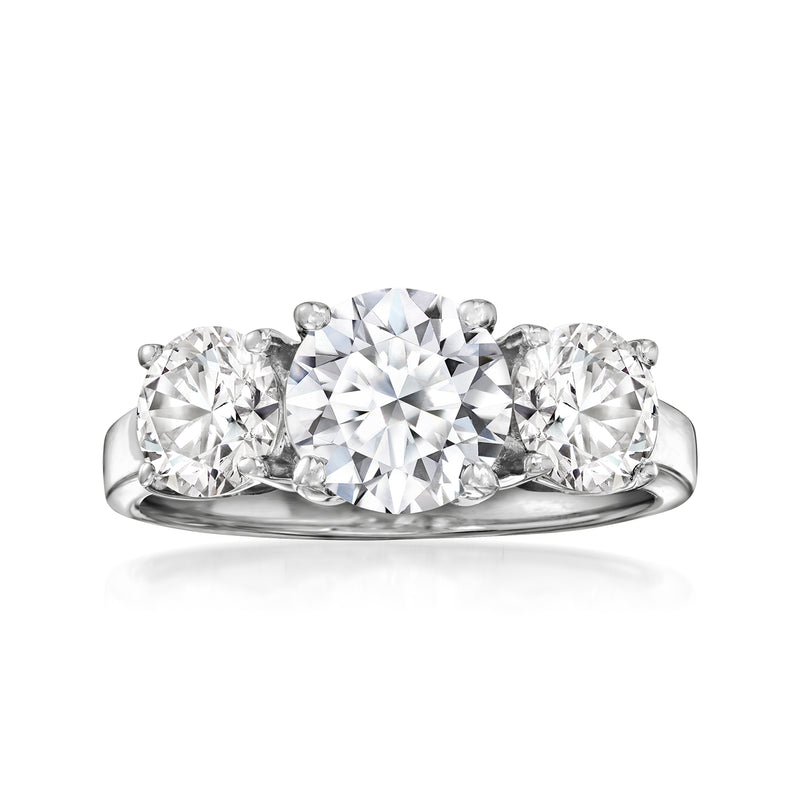 Platinum three-stone lab-grown diamond ring with round center diamond and side stones