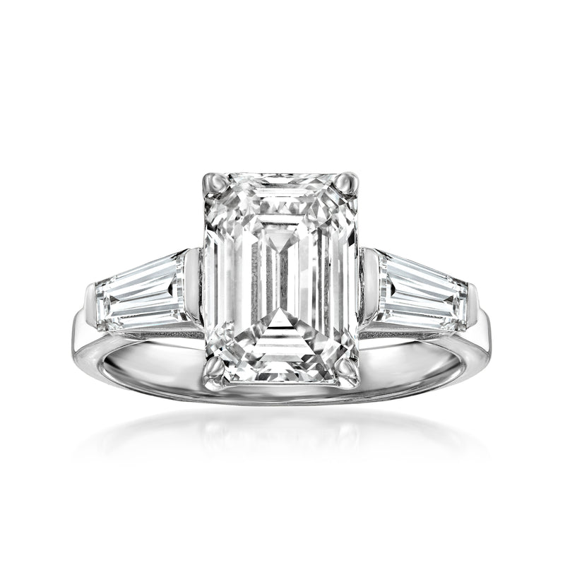 Platinum diamond ring with emerald-cut center stone and baguette side stones