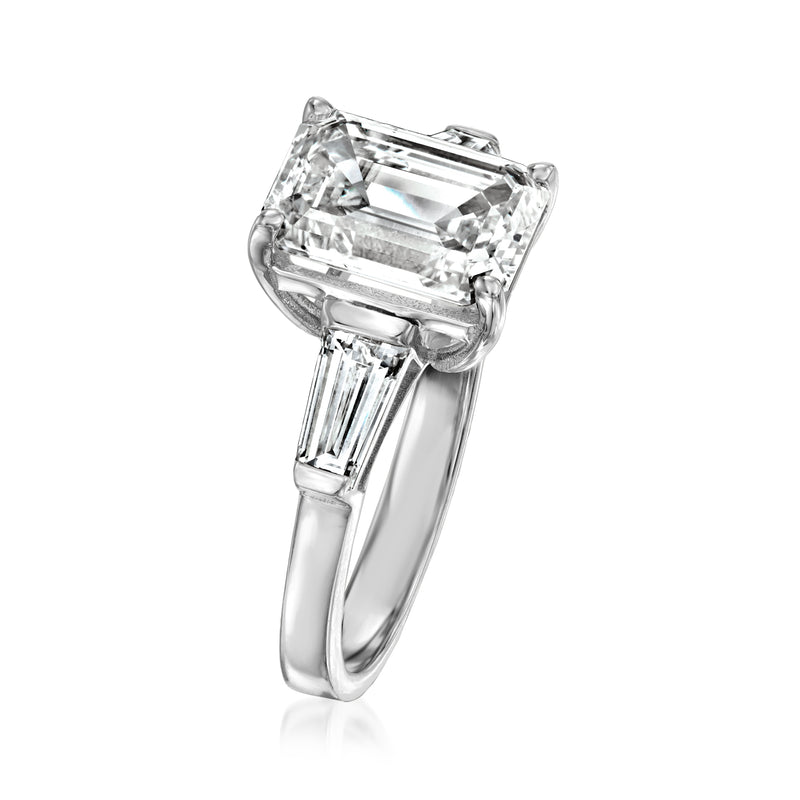 Platinum diamond ring angled view with large emerald-cut center and side baguettes