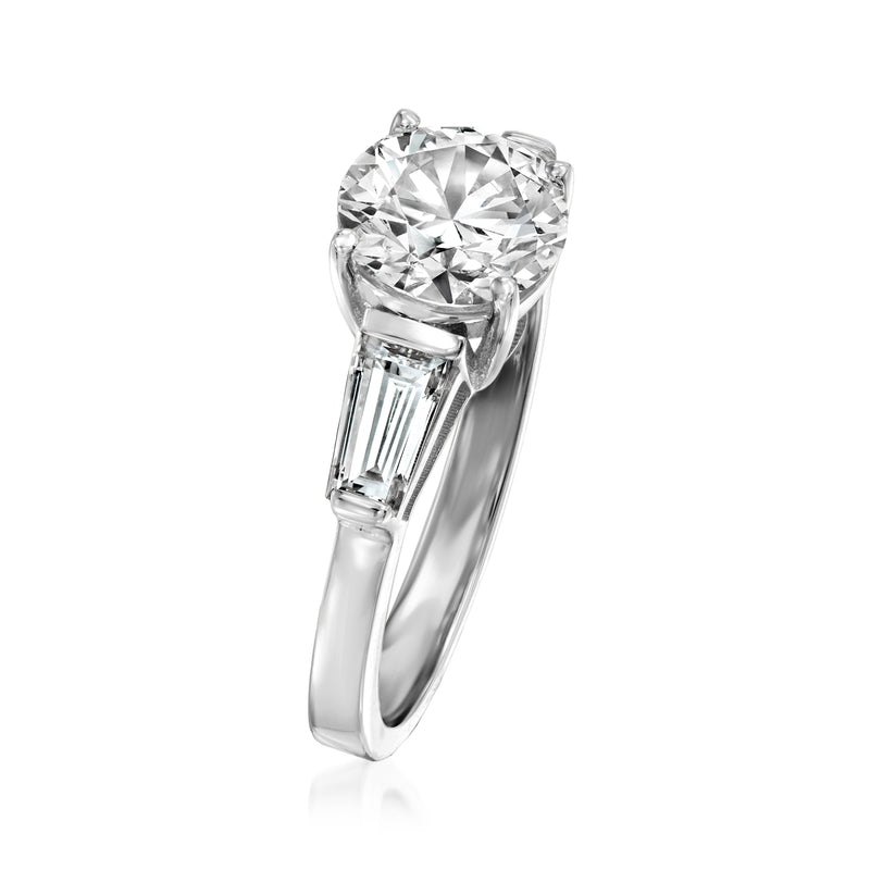 Platinum lab-grown diamond ring showing round center with baguette sidestones
