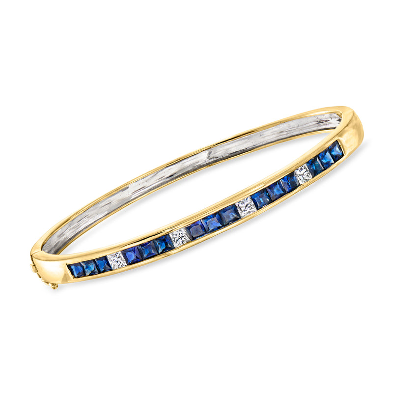 18kt yellow gold bangle bracelet with blue sapphire and diamond accents, open oval setting
