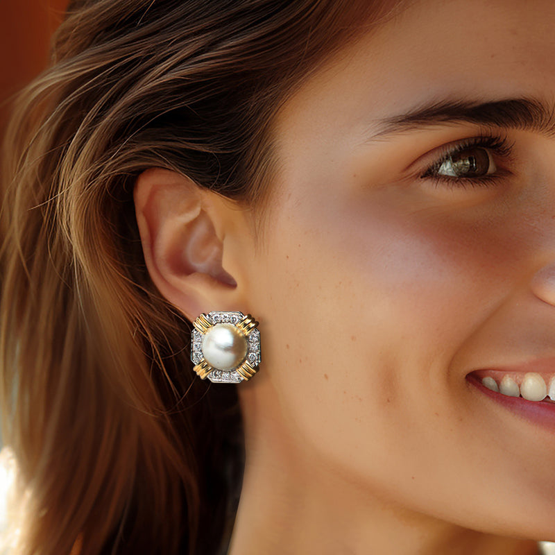 Two-tone gold mabe pearl diamond hoop-style earrings on model's ear