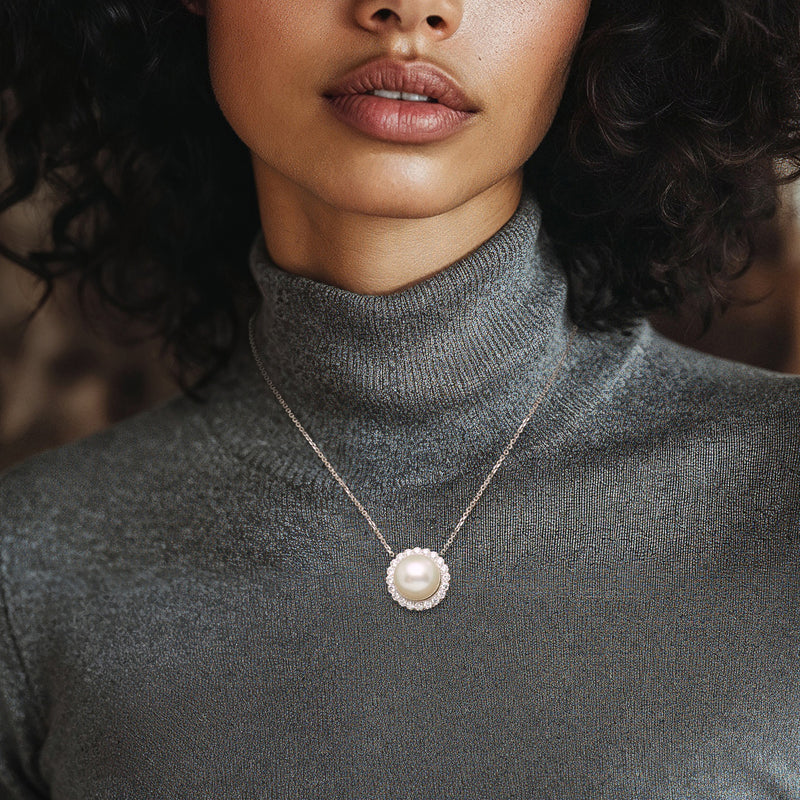 Cultured pearl pendant necklace on white gold chain, worn at collar length