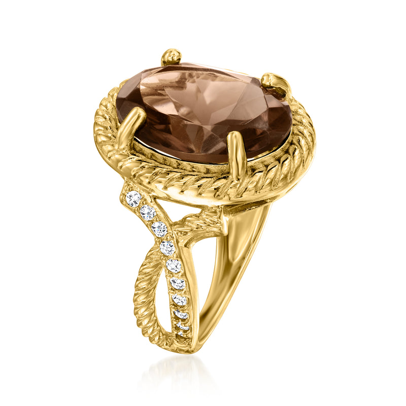 Gold-tone oval smoky quartz ring with clear side stones and braided rope halo