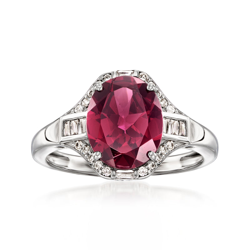Oval rhodolite garnet ring in platinum with diamond halo and side baguettes