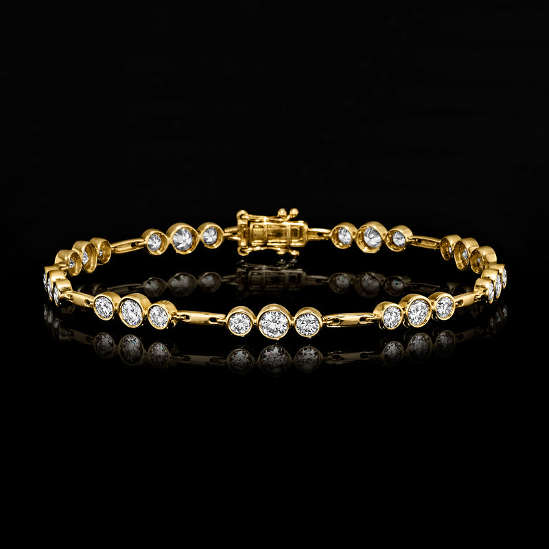 14kt yellow gold diamond station bracelet with round bezel-set stones and box clasp