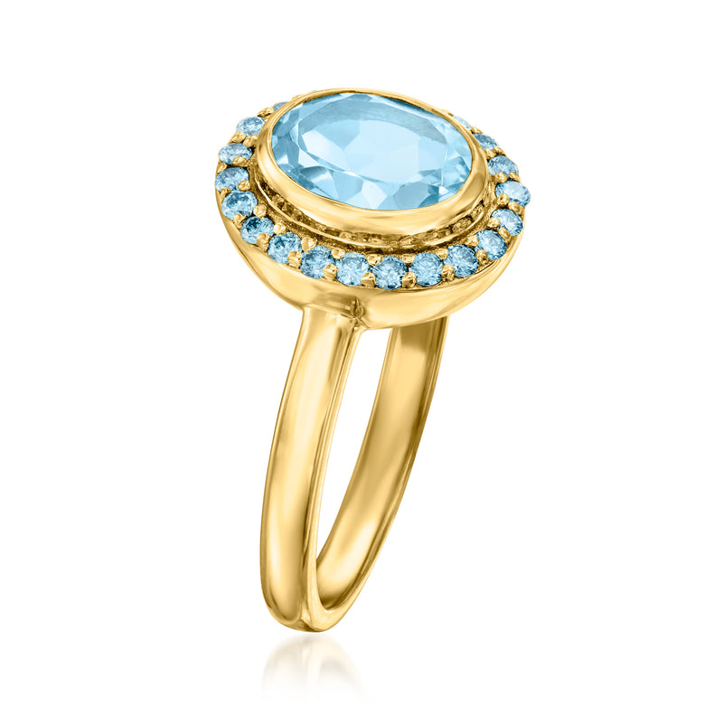 Gold ring with oval sky-blue center stone, round blue halo, openwork slender shank