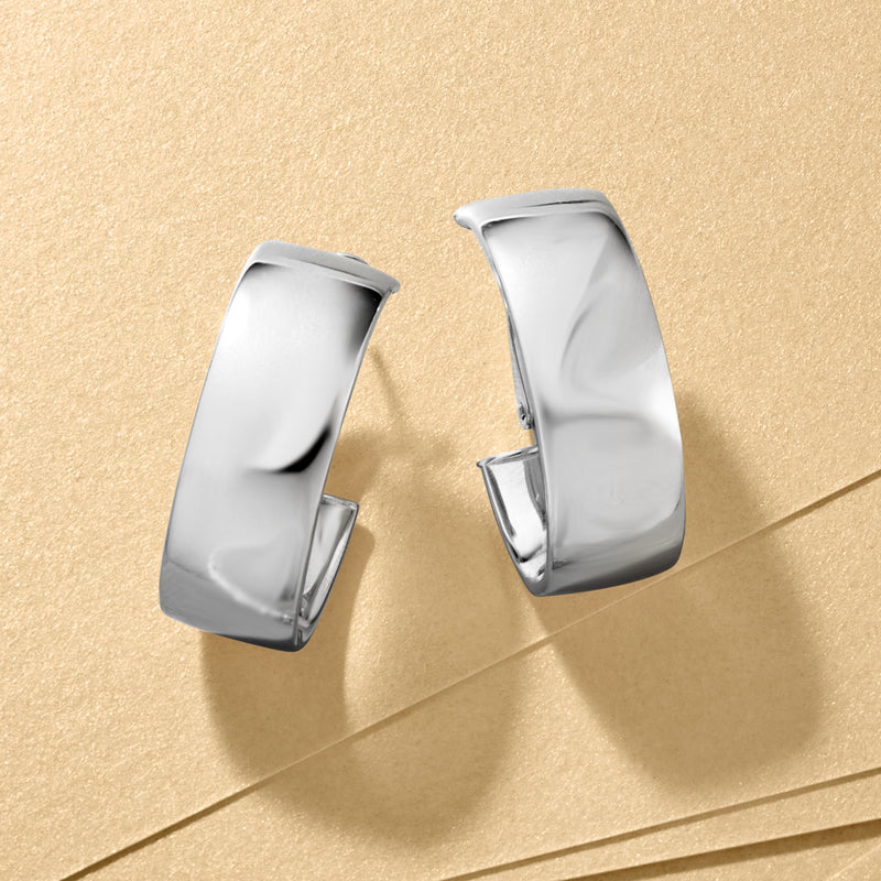 Polished oval hoop earrings with a wide profile and hinged closure