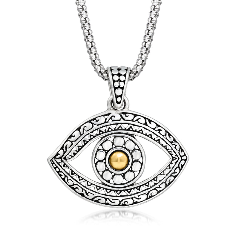 Silver evil eye pendant necklace with yellow gold center and engraved Bali-style border