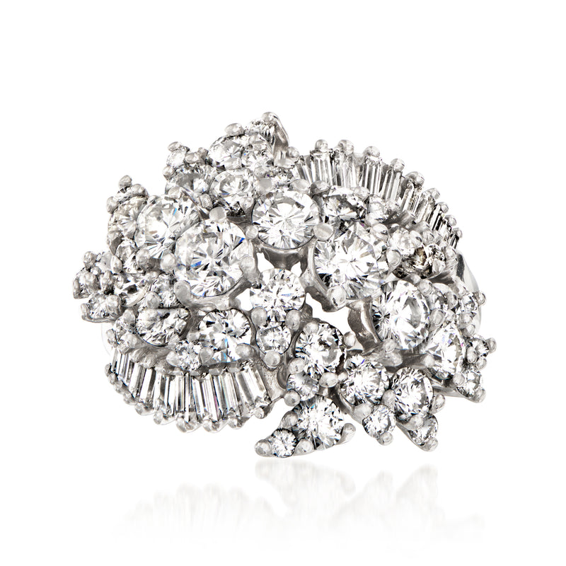 Vintage platinum diamond cluster ring with round stones and baguette accents
