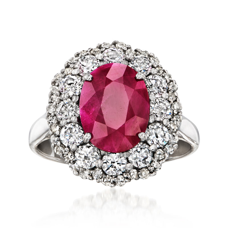 Ruby ring with oval ruby and diamond halo in white gold