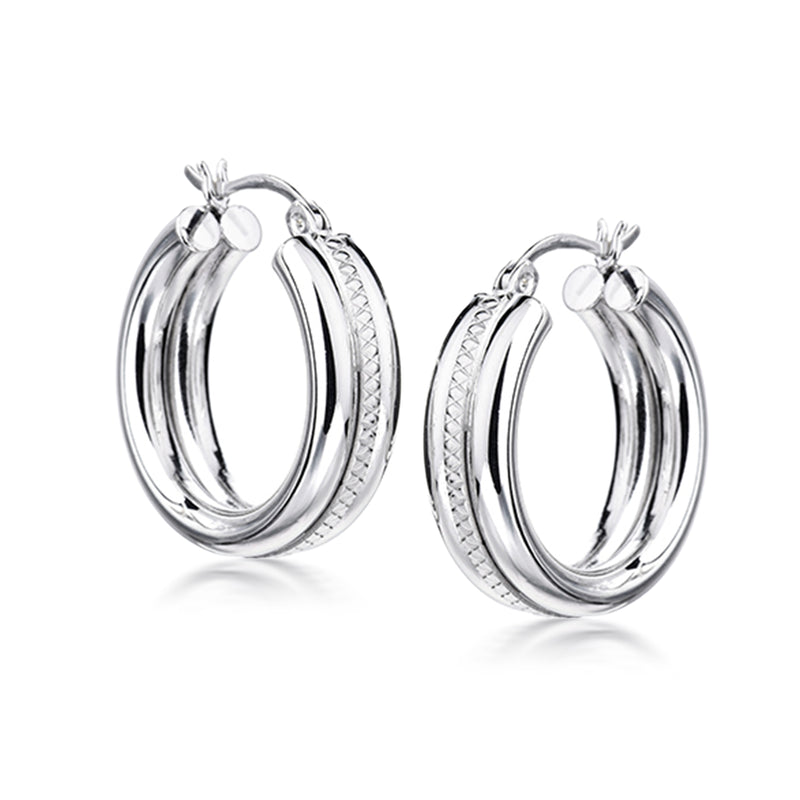 Sterling silver layered hoop earrings with textured outer rim and small clasp