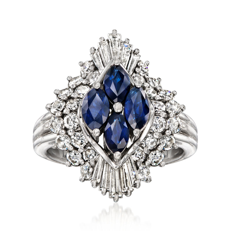 Platinum sapphire and diamond ring with oval blue center and halo of round diamonds