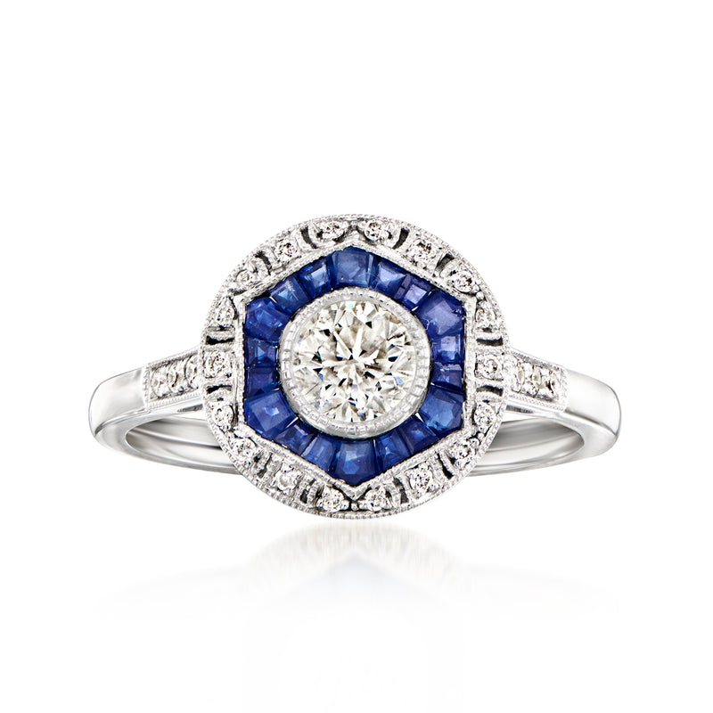 Platinum ring with oval diamond center, blue sapphire halo, and diamond accents