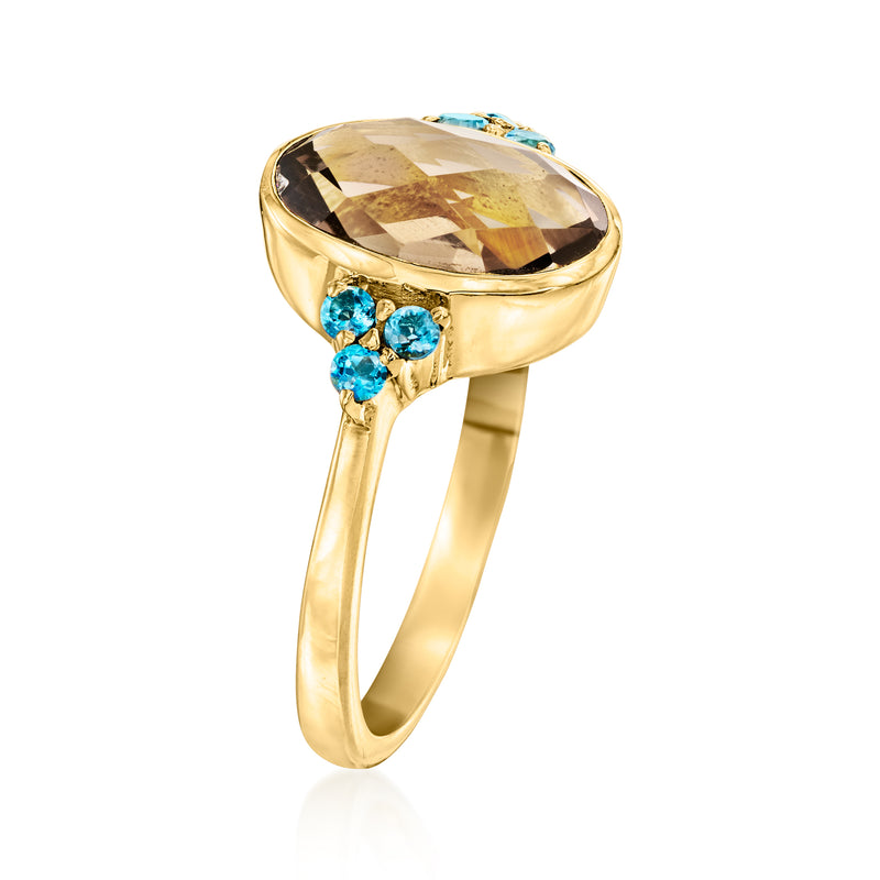 Gold-tone side view oval smoky quartz ring with blue topaz cluster shoulders