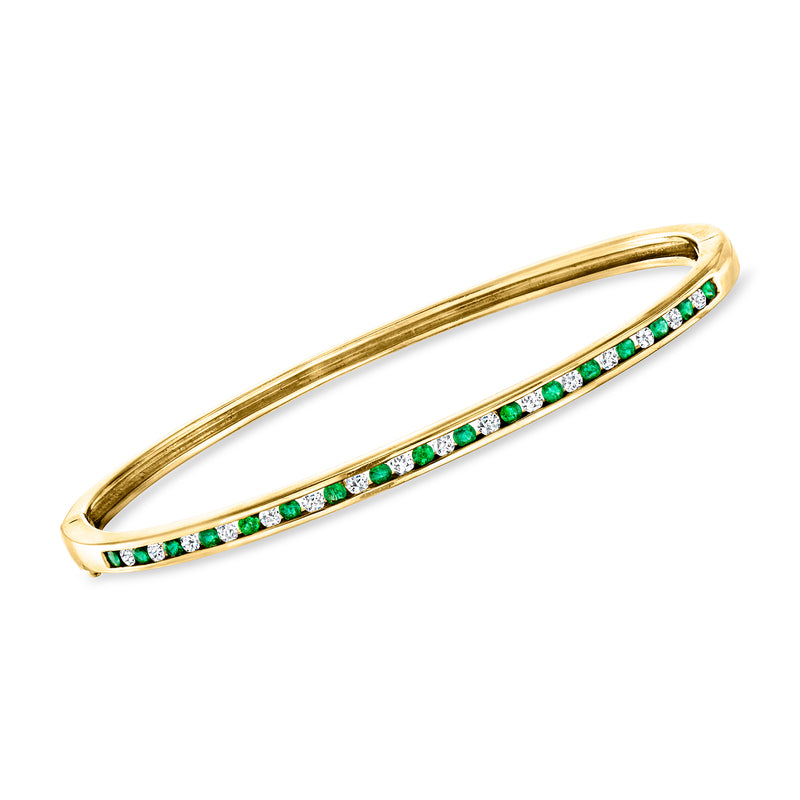 14kt yellow gold bangle bracelet with emerald and diamond row accents