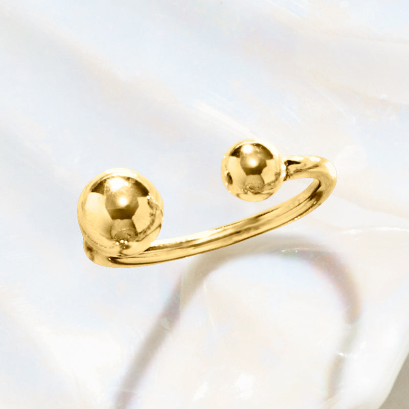 Gold-tone beaded ring with two round domed beads on a smooth open curved band
