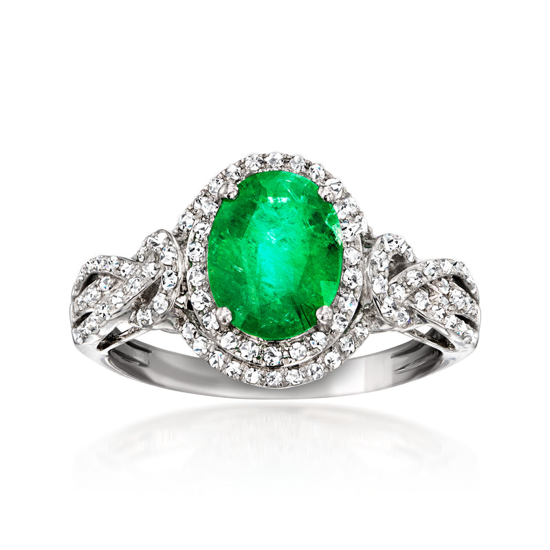 14kt white gold emerald-cut green gemstone ring with diamond halo and side clusters